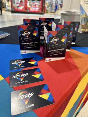 table with Watford gift cards on it