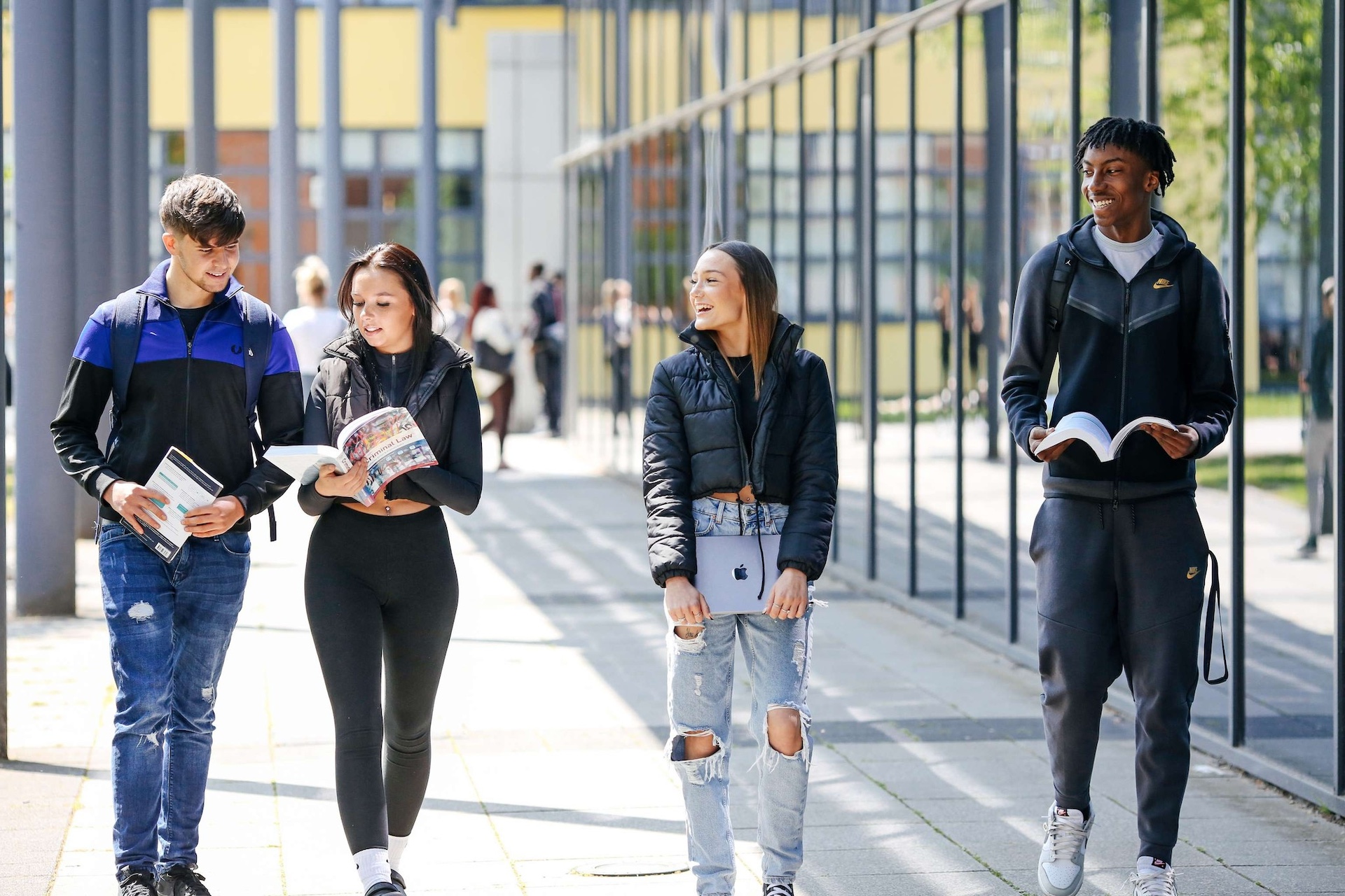 students walking by the college