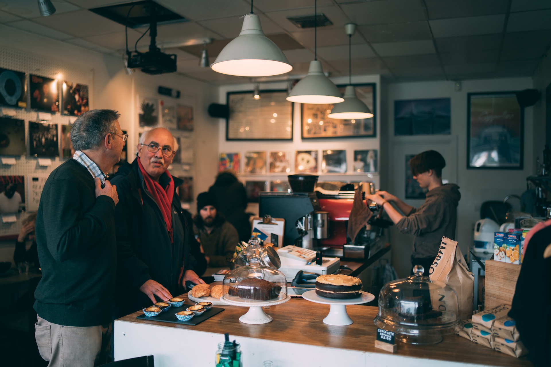 Barista serving customers in a cafe