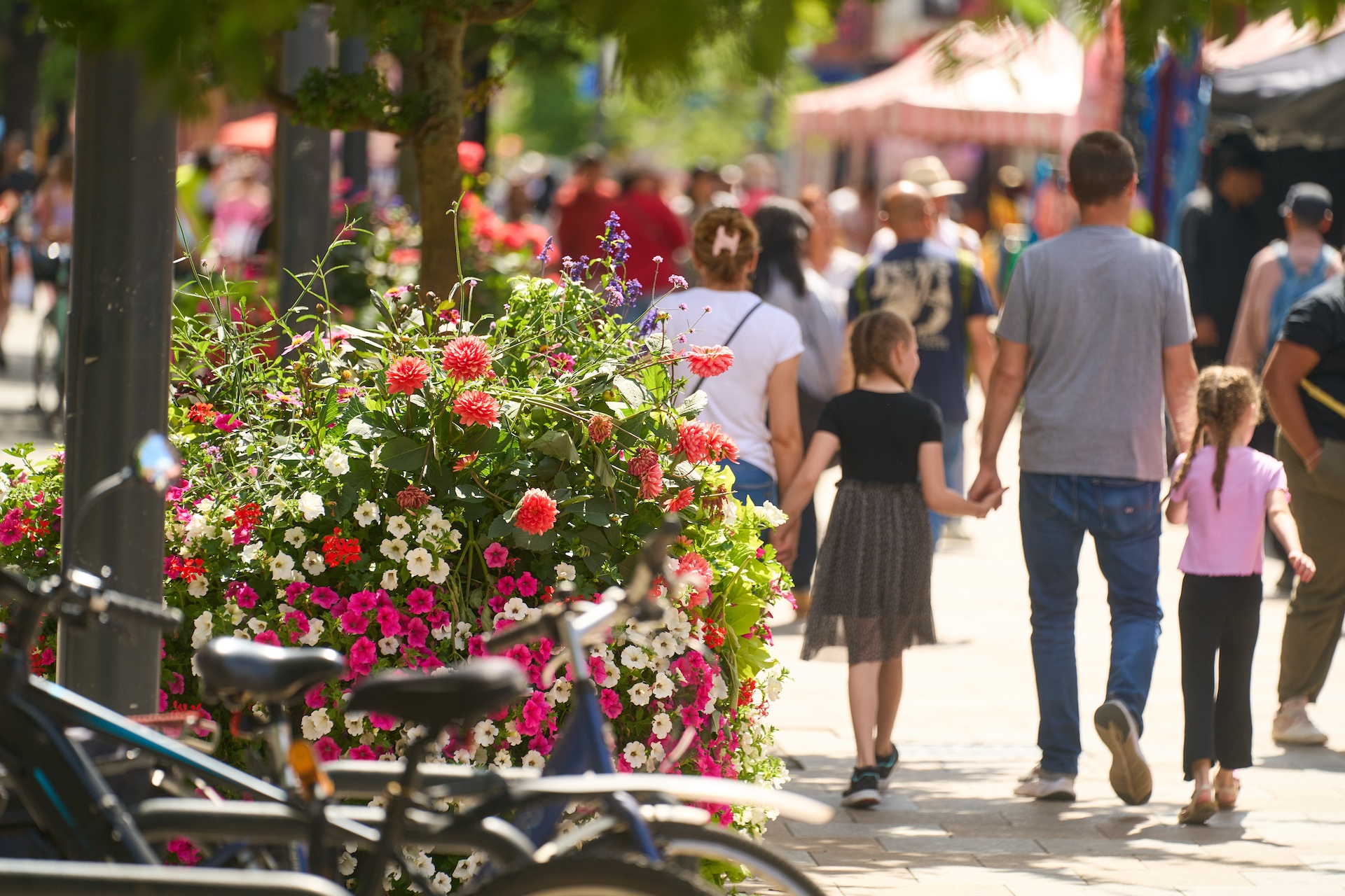 family walking next to floral displays