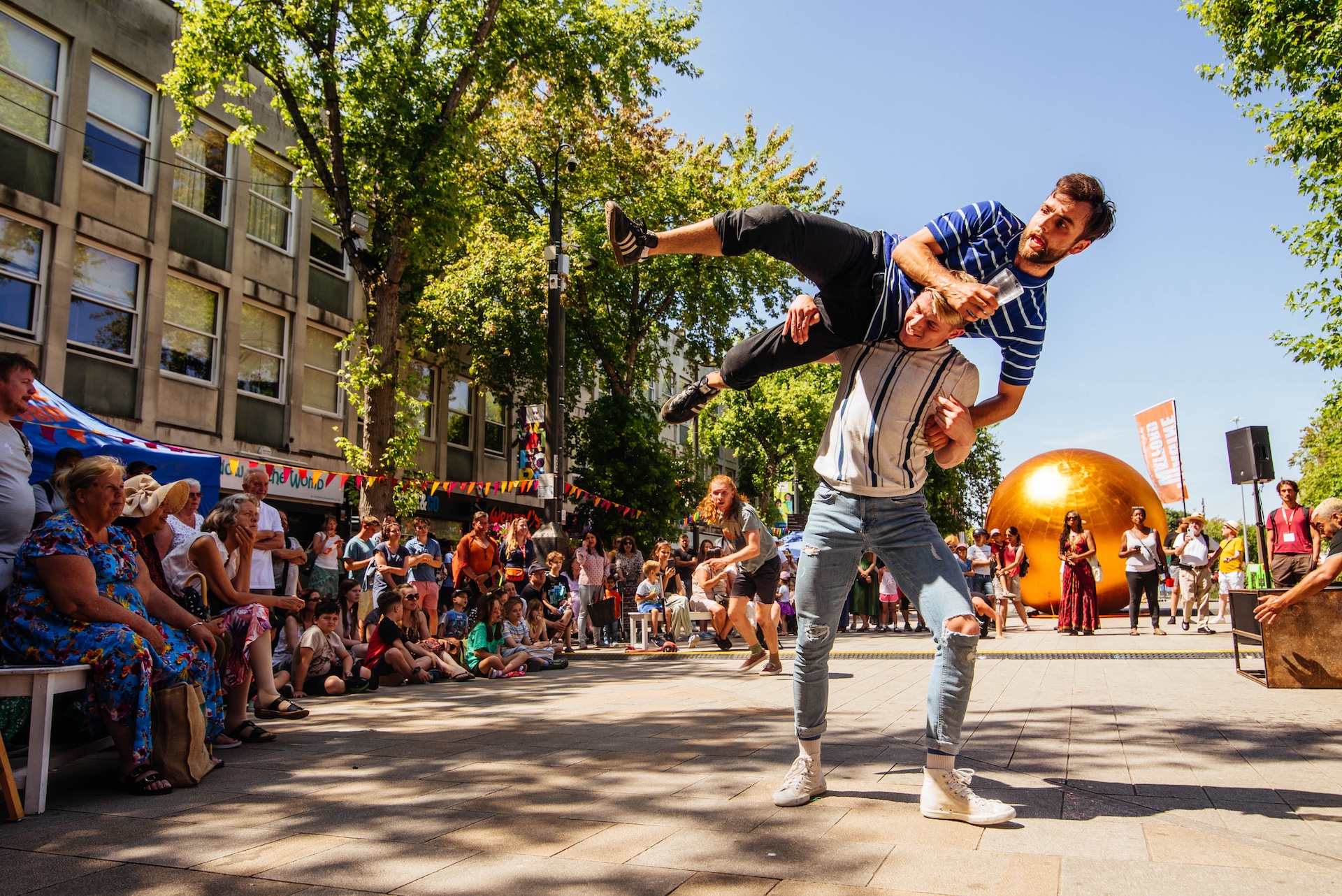 Street performers performing a balancing act